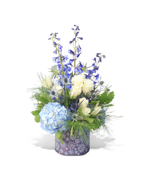 blue and white flowers in snowflake container