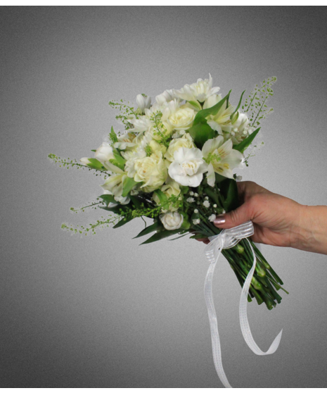 white flowers in small nosegay held in manicured hand