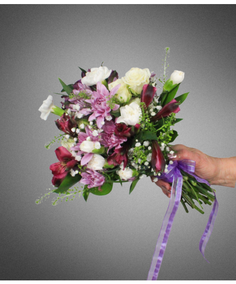 white flowers in small nosegay held in manicured hand
