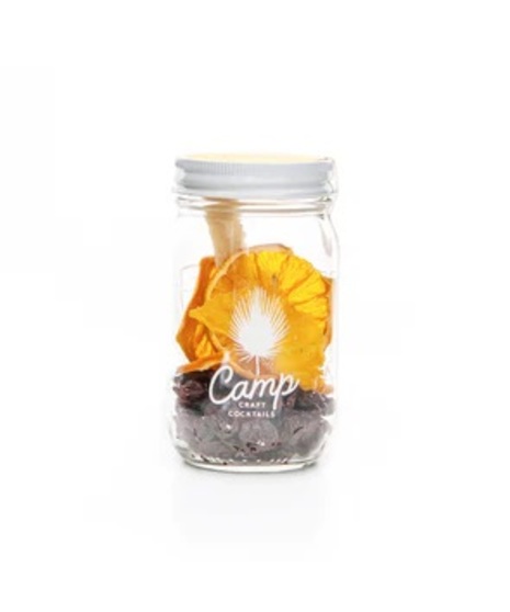 cute mason jar with assortment of botanical ingredients